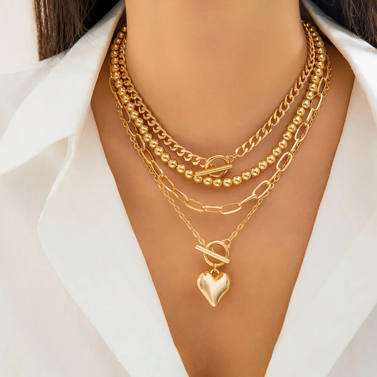 HeartGleam - 4 Piece Necklace Set with Gold Heart-Shaped Pendants