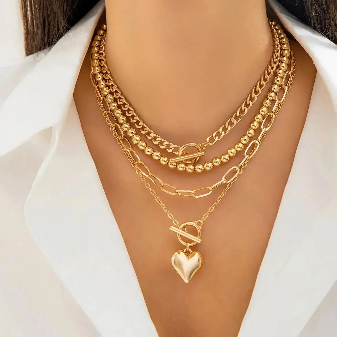 HeartGleam - 4 Piece Necklace Set with Gold Heart-Shaped Pendants